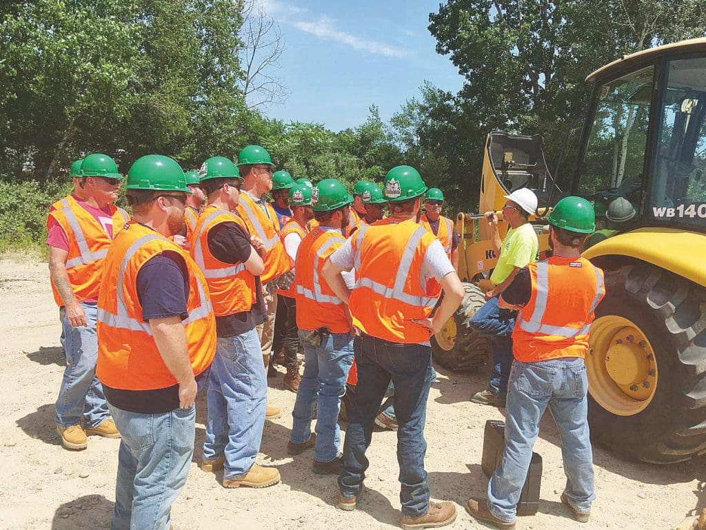 Our heavy equipment training school is perfect for people who are looking for a great career in heavy construction. Here is a group of heavy equipment training students gathered for an instruction meeting with a qualified trainer.