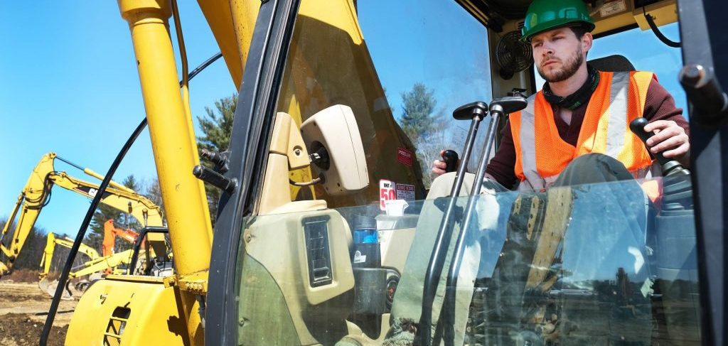 Heavy equipment operator training taking place in a piece of heavy machinery. This student is learning to be a heavy machine operator in a bulldozer.